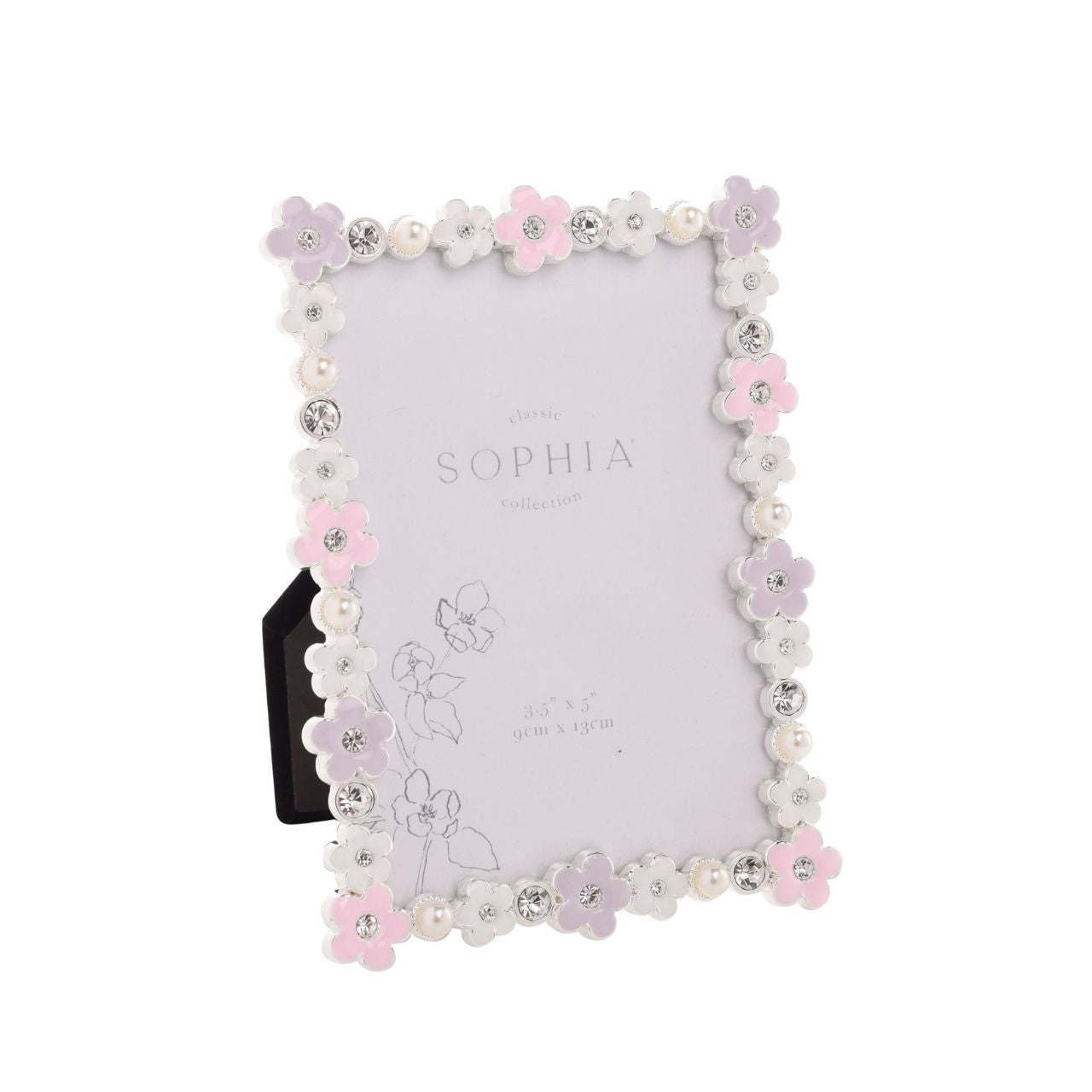 Introducing the Sophia Classic Daisy 3.5" x 5" Frame - Pastel, a delightfully charming piece that pairs perfectly with precious memories. Adorned with delicate white and pink flowers, it’s a treat for the eyes, while sparkling rhinestones add glamour.