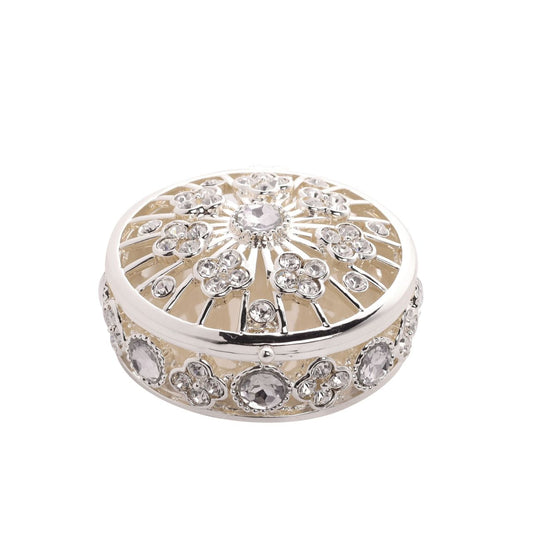 Introducing the Sophia Classic Open Work Trinket Box, a round and ornate piece that effortlessly captures elegance and charm. Dotted with twinkling crystals or diamonds, its intricate floral design sets the stage for a captivating display, making it the perfect keepsake or gift.