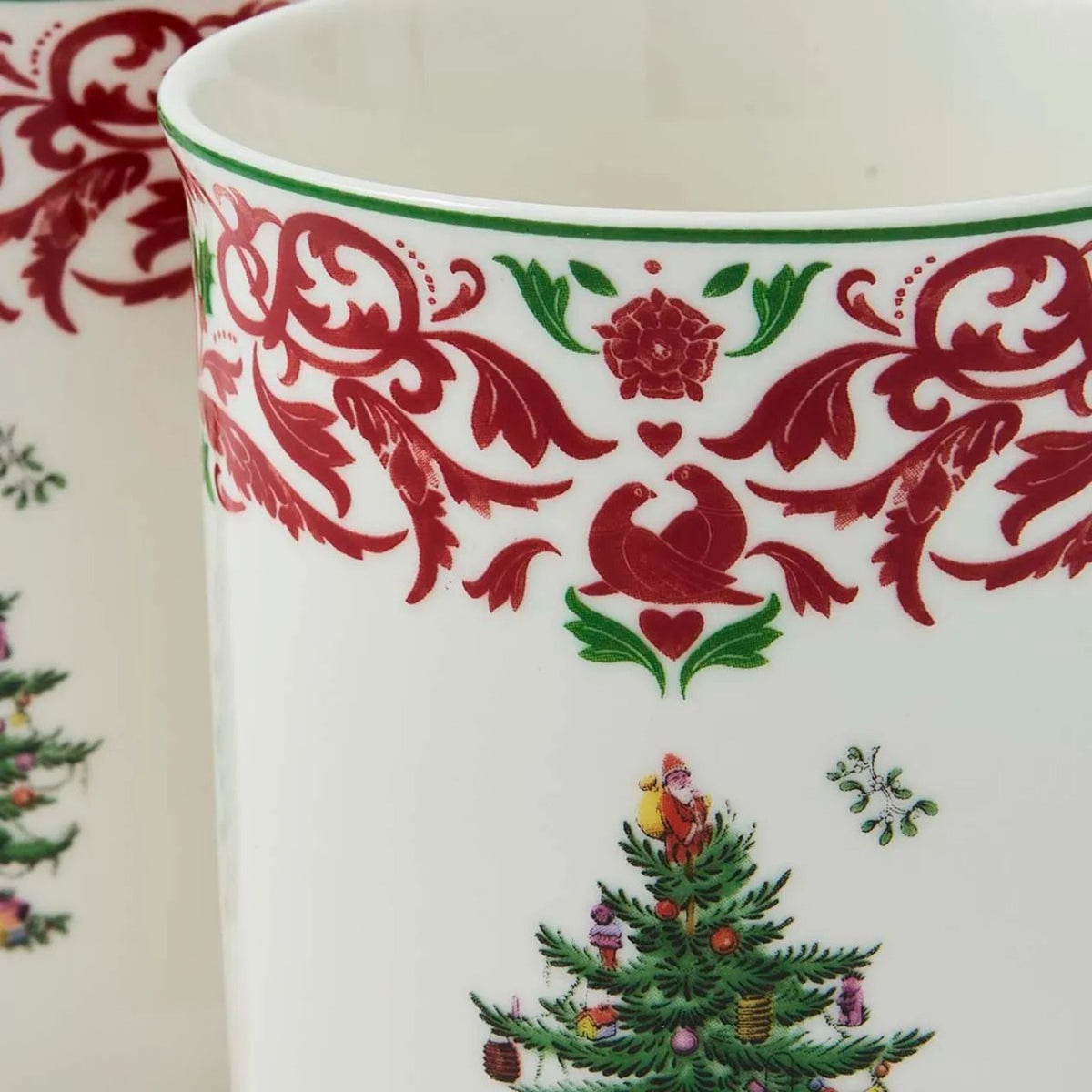 The Spode Christmas Tree Annual 2026 5pc Mug & Tin Set pairs festive charm with practical gifting appeal. Featuring two 12fl.oz mugs with a red and green scroll border and matching cork-backed coasters, the coordinating tin they are packaged in makes a beautifully presented collectors' gift.