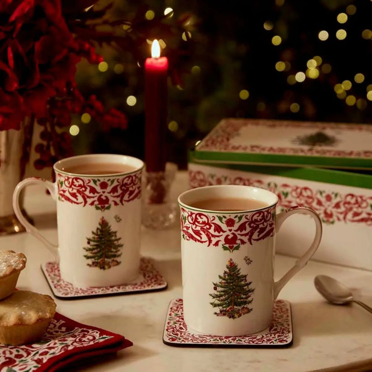 The Spode Christmas Tree Annual 2026 5pc Mug & Tin Set pairs festive charm with practical gifting appeal. Featuring two 12fl.oz mugs with a red and green scroll border and matching cork-backed coasters, the coordinating tin they are packaged in makes a beautifully presented collectors' gift.