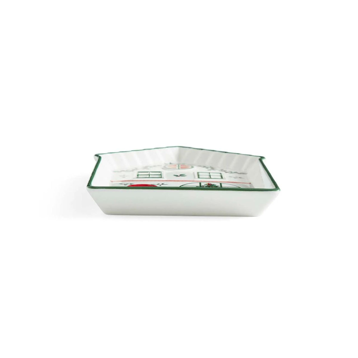 This charming ceramic tidbit tray from Spode is shaped like the front of a delightfully festive house, perfect for adding a touch of holiday charm to your table. The house features a welcoming green door flanked by two charming Christmas trees, inviting red windows, and a delightful display of festive foliage.