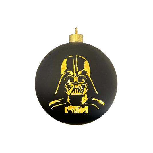 Bring the dark side to your Christmas tree with this Star Wars Darth Vader Lighted Christmas Bauble. Featuring the iconic Sith Lord design, this collectible ornament combines festive cheer with galactic flair.