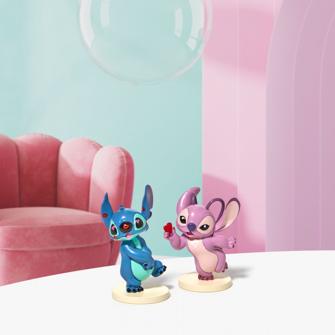Grand Jester Stitch Covered in Kisses Mini Figurine  This super cute Stitch has been covered in lipstick kisses and looks loved up. He is made from high quality vinyl and is the perfect addition to any Stitch fans collection or bought as a gift for a birthday, Valentines or as a little treat.