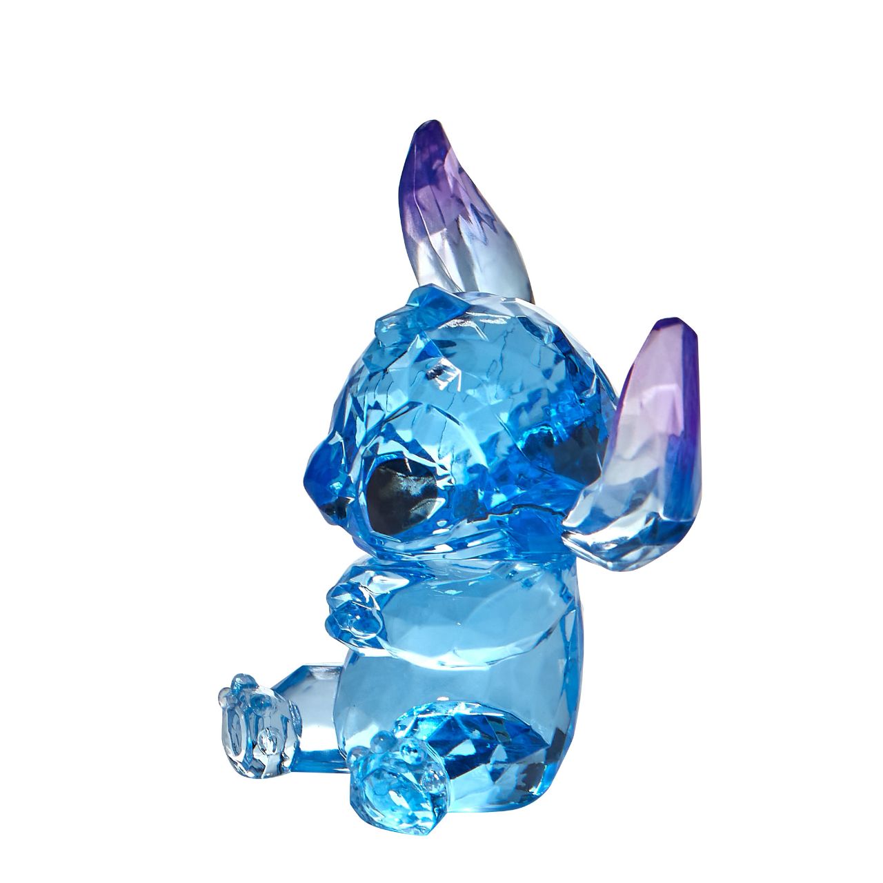 Disney Stitch Facets Figurine  This "gem cut" acrylic sculpture reflects Stitch's sparkling personality and childlike charm. Presented in a branded window gift box. Not a toy or children's product. Intended for adults only.