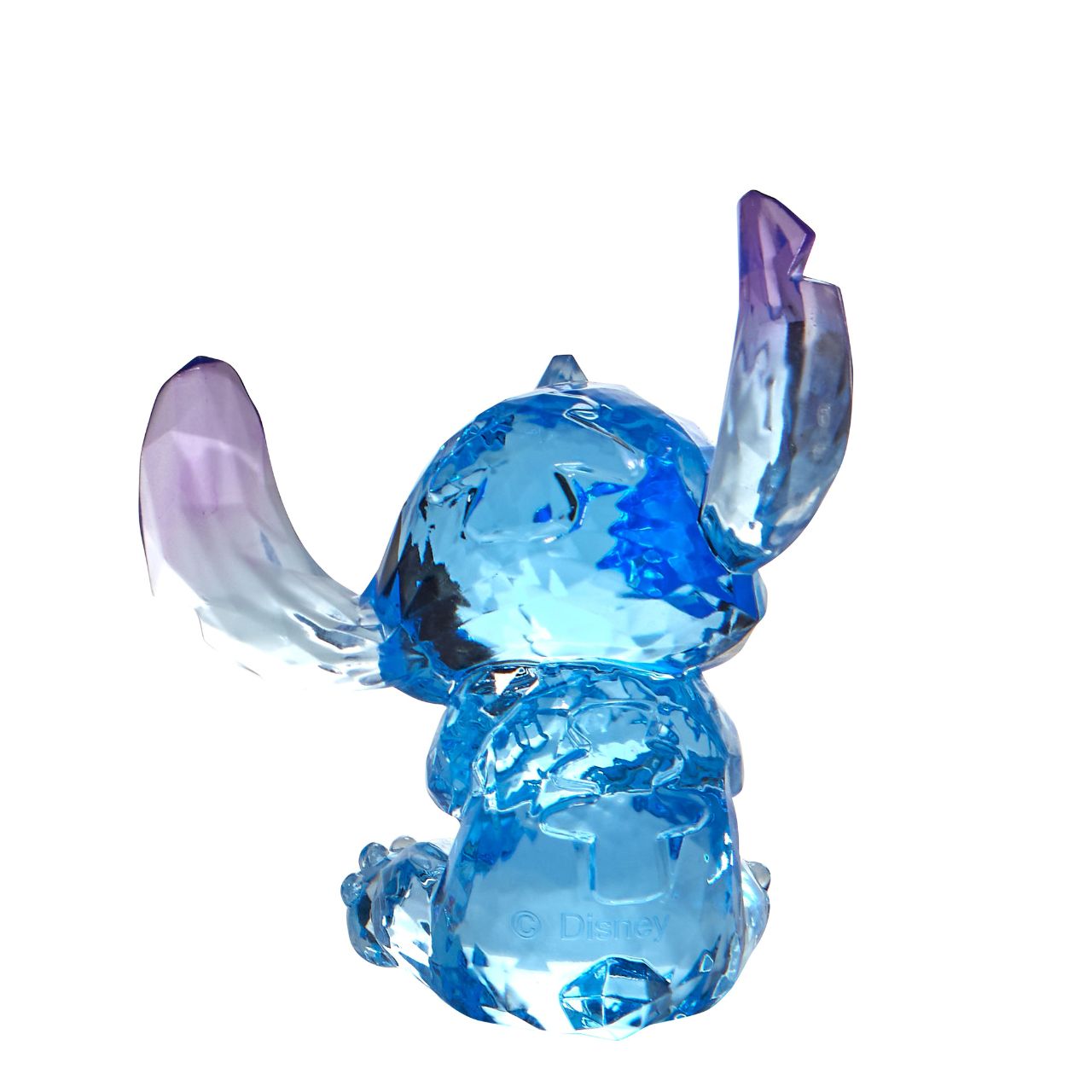 Disney Stitch Facets Figurine  This "gem cut" acrylic sculpture reflects Stitch's sparkling personality and childlike charm. Presented in a branded window gift box. Not a toy or children's product. Intended for adults only.