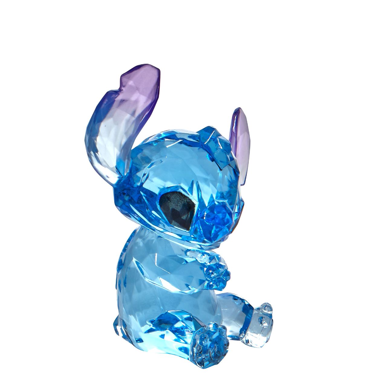 Disney Stitch Facets Figurine  This "gem cut" acrylic sculpture reflects Stitch's sparkling personality and childlike charm. Presented in a branded window gift box. Not a toy or children's product. Intended for adults only.