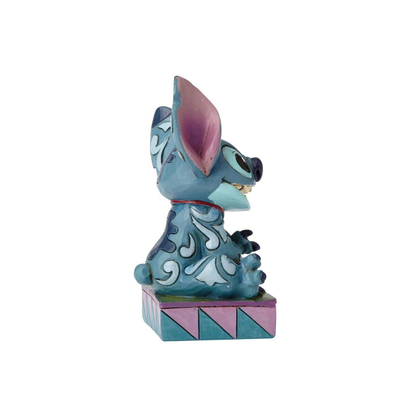 Disney Traditions Stitch Ohana Means Family  Designed by award winning artist and sculptor, Jim Shore for the Disney Traditions brand, this Stitch figurine is a part of a personality poses collection. He is featured displaying his typical mischievous smile.
