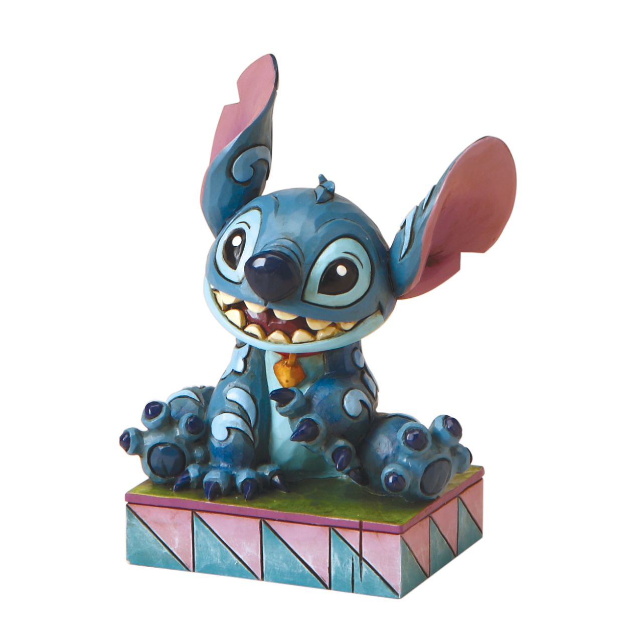 Jim Shore Stitch Ohana Means Family  Designed by award winning artist and sculptor, Jim Shore for the Disney Traditions brand, this Stitch figurine is a part of a personality poses collection. He is featured displaying his typical mischievous smile.