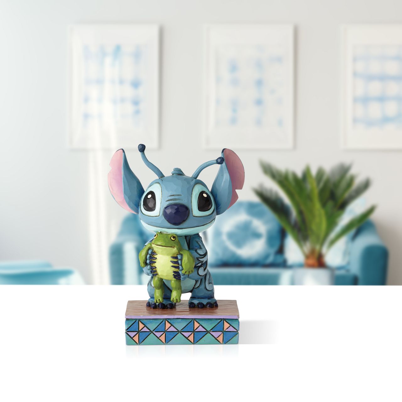 Jim Shore Strange Life-Forms Stitch with Frog Figurine  Almost too cute to handle, this handcrafted design shows Stitch holding Frog just moments after he saved the little guy's life.