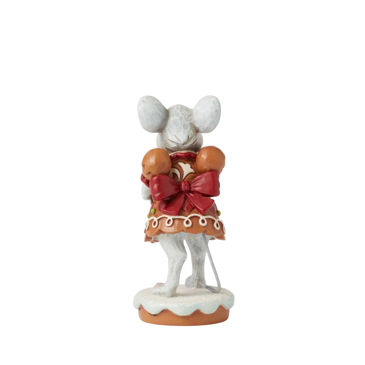 Wearing a festive gingerbread dress covered in intricate icing details, this sweet Gingerbread Christmas girl mouse by Jim Shore offers a sprinkled cookie with a warm smile.