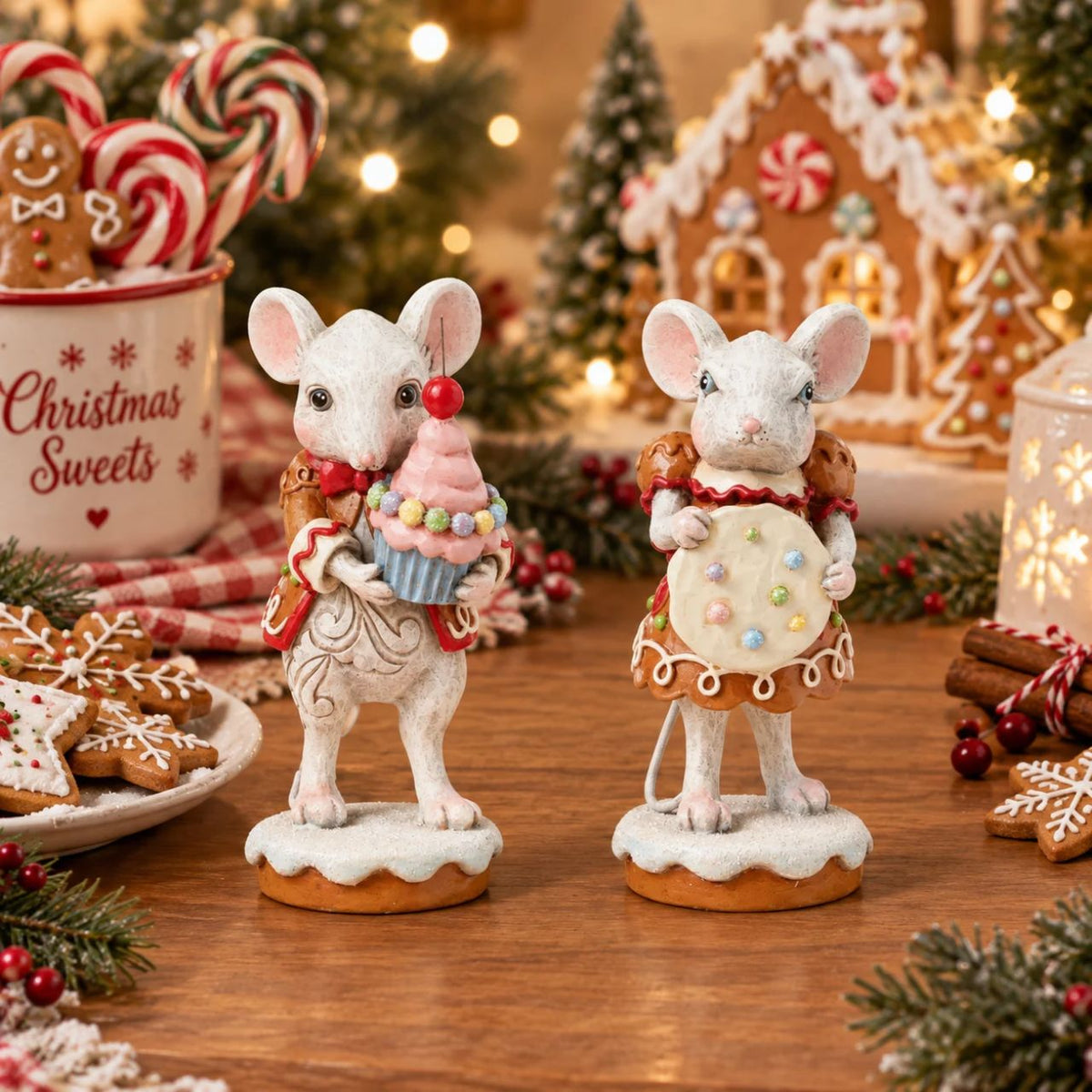 Wearing a festive gingerbread dress covered in intricate icing details, this sweet Gingerbread Christmas girl mouse by Jim Shore offers a sprinkled cookie with a warm smile.