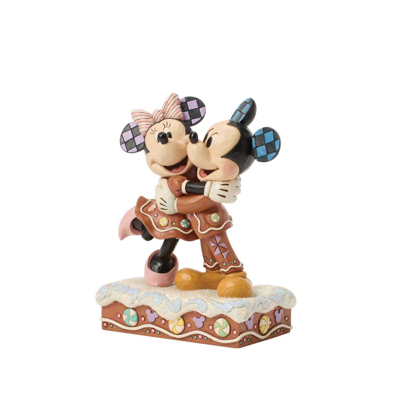 Sweet as sugar, Mickey and Minnie Mouse are decorated like gingerbread cookies in this charming Jim Shore holiday design. With peppermints and rosemaling accents, they look fresh from the oven and full of Christmas cheer as they embrace with love.