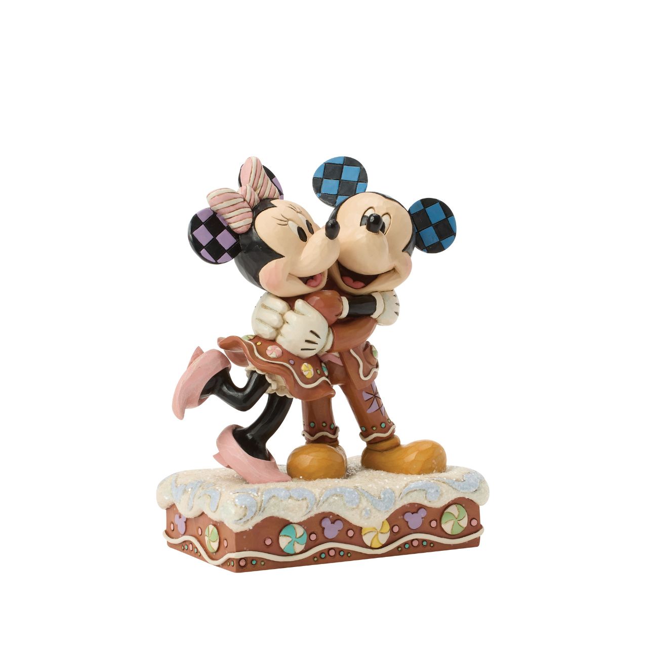 Sweet as sugar, Mickey and Minnie Mouse are decorated like gingerbread cookies in this charming Jim Shore holiday design. With peppermints and rosemaling accents, they look fresh from the oven and full of Christmas cheer as they embrace with love.