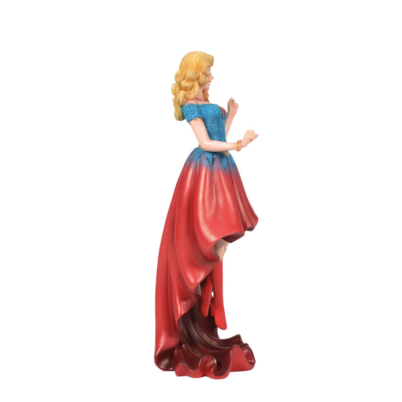 Fierce meets fabulous in this meticulously reimagined hand-crafted figure inspired by DC Comics most iconic heroines and villains. Shimmering with metallic paint accents on her flowing stylish skirt, Supergirl is mid-flight ready to conquer the world.