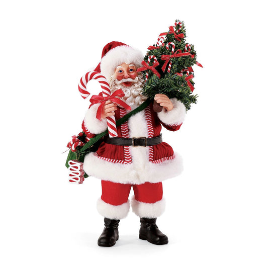 Department 56 Possible Dreams Sweet Treats - Santa  This Santa comes loaded with a Sweet Treat decorated tree that is perfect for the festive season. Featuring ribbon wrapped candy canes displayed on a miniature tree, along with a sack full to the brim with more sweeties. And of course a giant candy cane for everyone to share. Each Possible Dreams Santa has been uniquely sculpted before hand painted by our skilled artists.