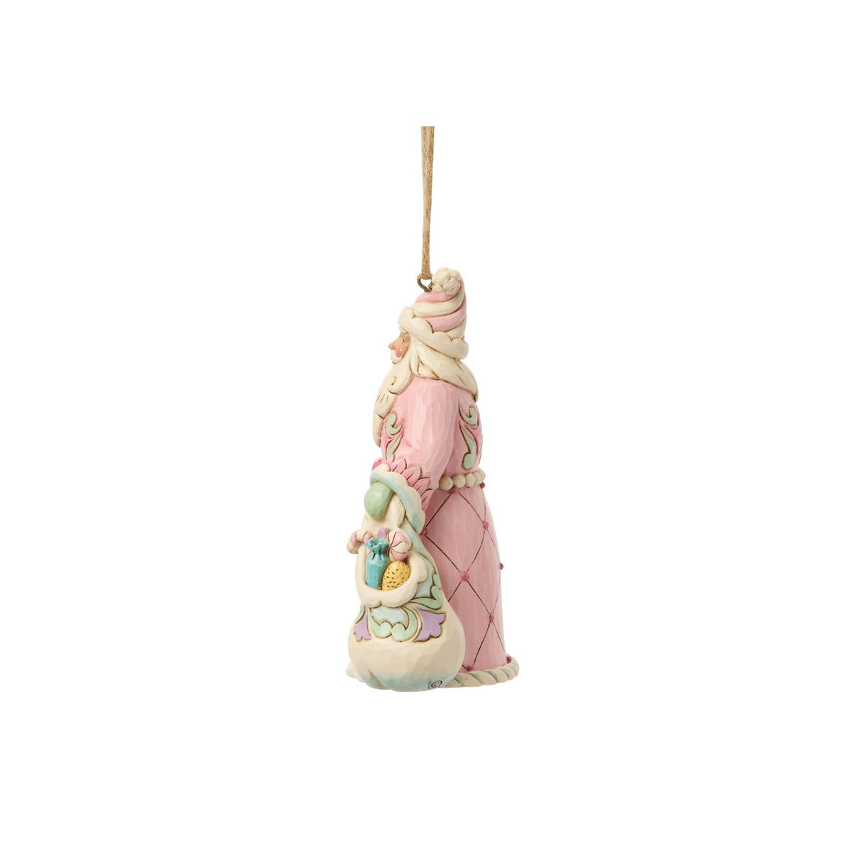 This cheerful Santa ornament carries a sack overflowing with colourful candy delights. Jim Shore's hand-painted details and rosemaling patterns give Santa a rich, festive charm. A sugary-sweet nod to childhood holiday dreams.