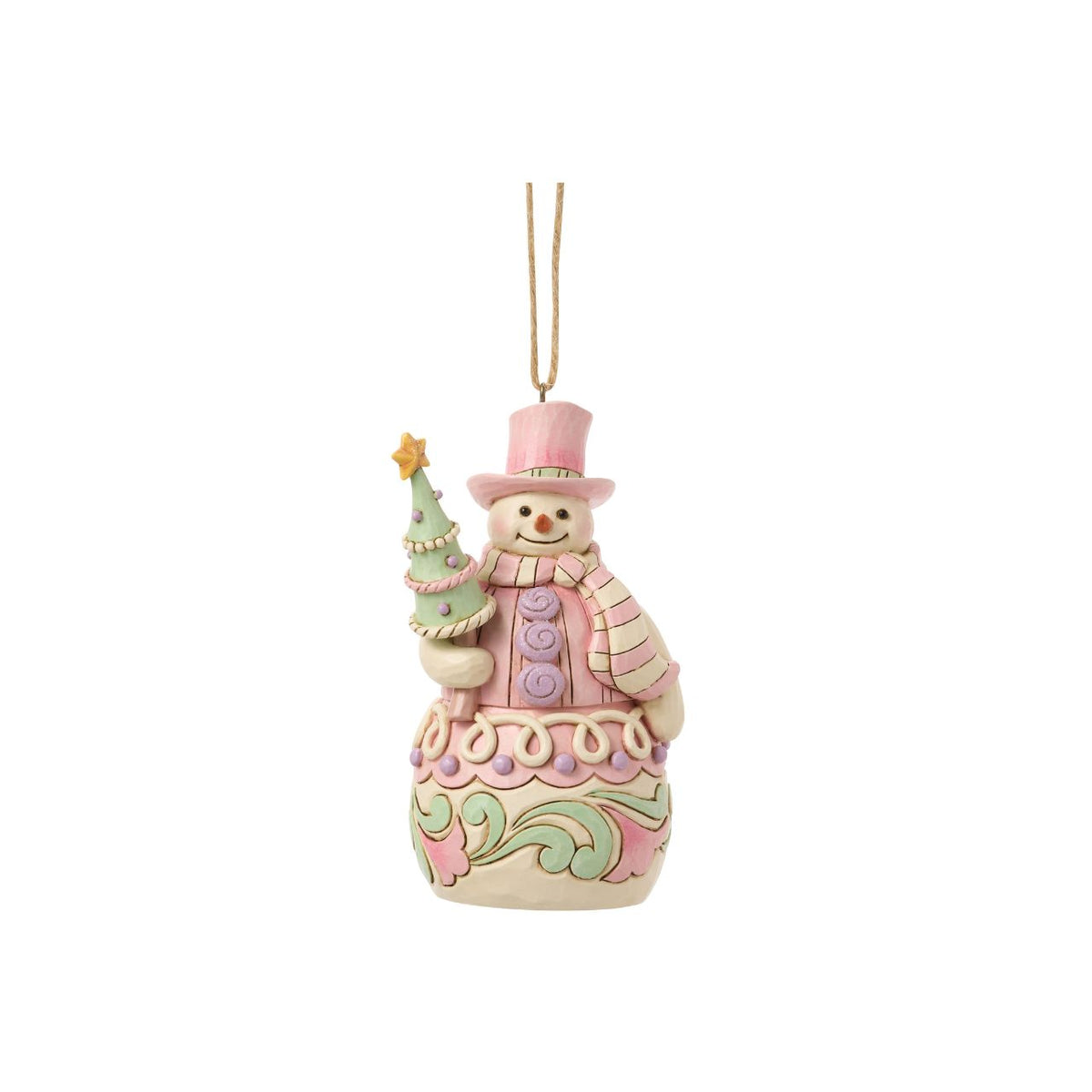 Bundled up for the season, this snowman ornament carries a decorated Christmas tree in his arms. Jim Shore's intricate designs swirl across his coat, adding heart-warming detail to this classic winter character. A joyful symbol of holiday sweetness.