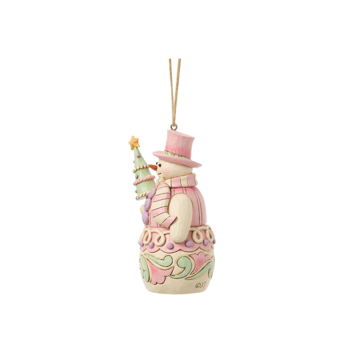 Bundled up for the season, this snowman ornament carries a decorated Christmas tree in his arms. Jim Shore's intricate designs swirl across his coat, adding heart-warming detail to this classic winter character. A joyful symbol of holiday sweetness.