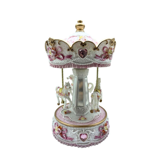 White and rose coloured Carousel turns to a welknow melody.