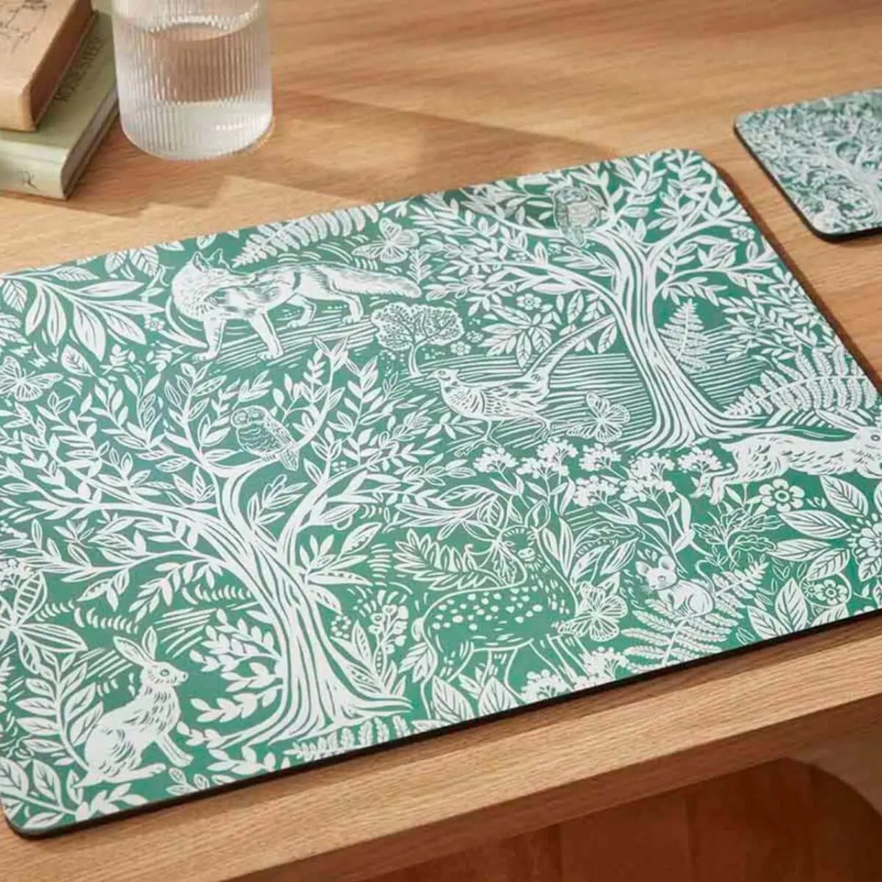 Coordinate placemats with matching Tapestry Sage coasters for a touch of nature