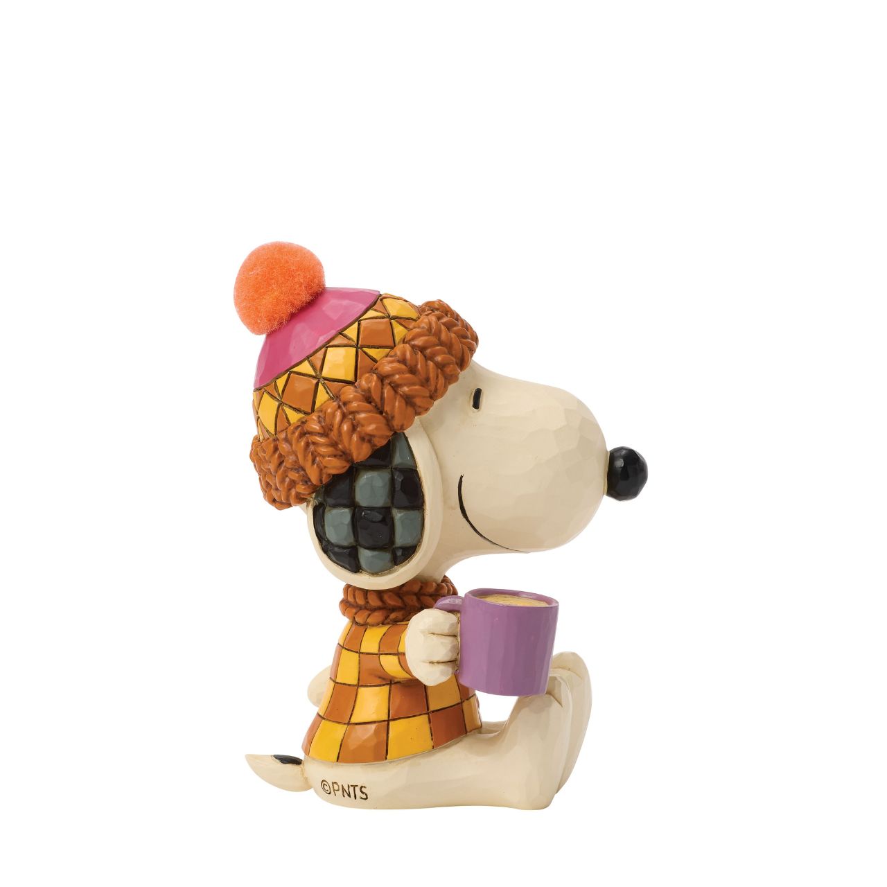 Snoopy bundles up in cosy shades of orange in this charming Jim Shore design. Dressed for fall with a pompom hat and a mug in hand, he brings warmth and whimsy to autumn days with classic folk-art touches.