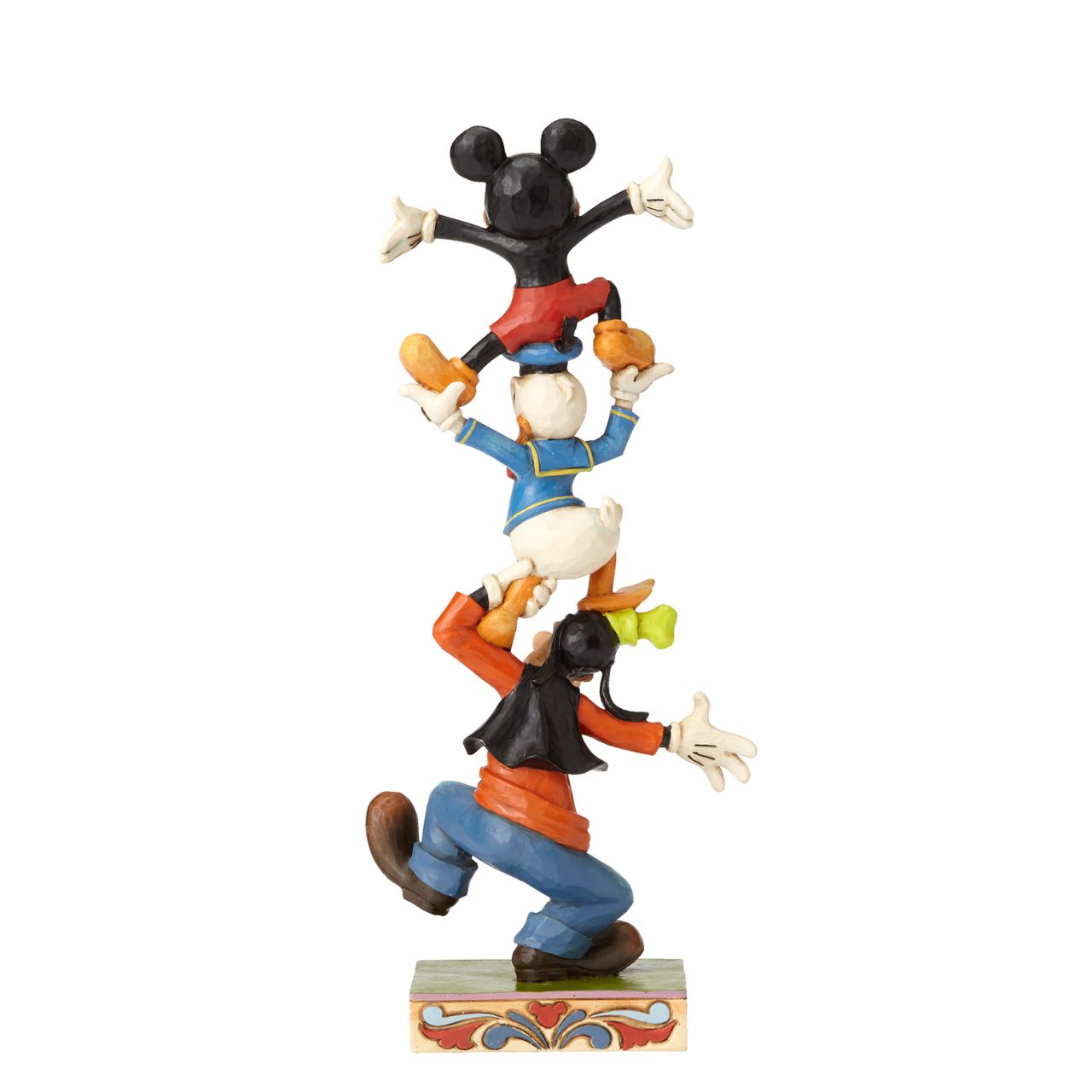 This stacked design features Goofy, a choleric Donald Duck and a triumphant Mickey Mouse on top. This cast stone figurine is beautifully handcrafted in the whimsical folk art style that is unmistakably Jim Shore.