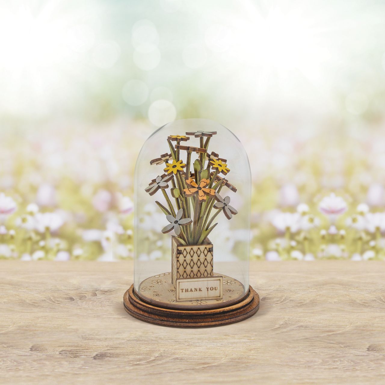 Say Thank You with this beautiful floral gift. This eco-friendly glass dome decoration encases a bunch of stunning yellow and white flowers, adorned with a Thank You plaque.