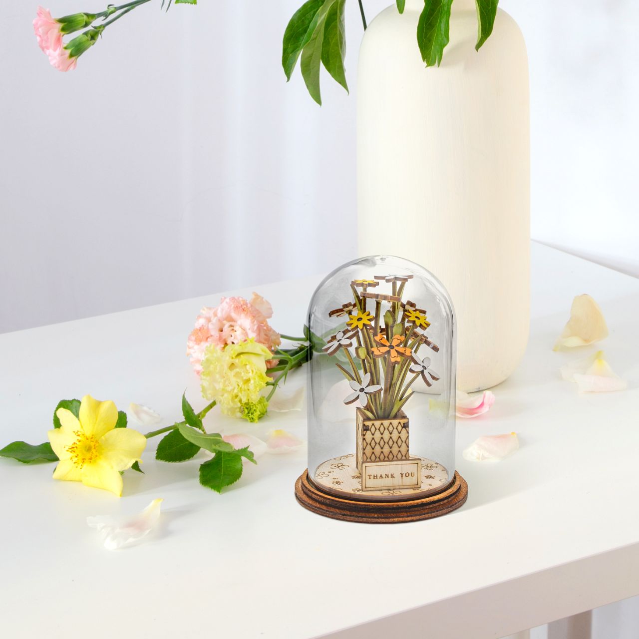 Say Thank You with this beautiful floral gift. This eco-friendly glass dome decoration encases a bunch of stunning yellow and white flowers, adorned with a Thank You plaque.
