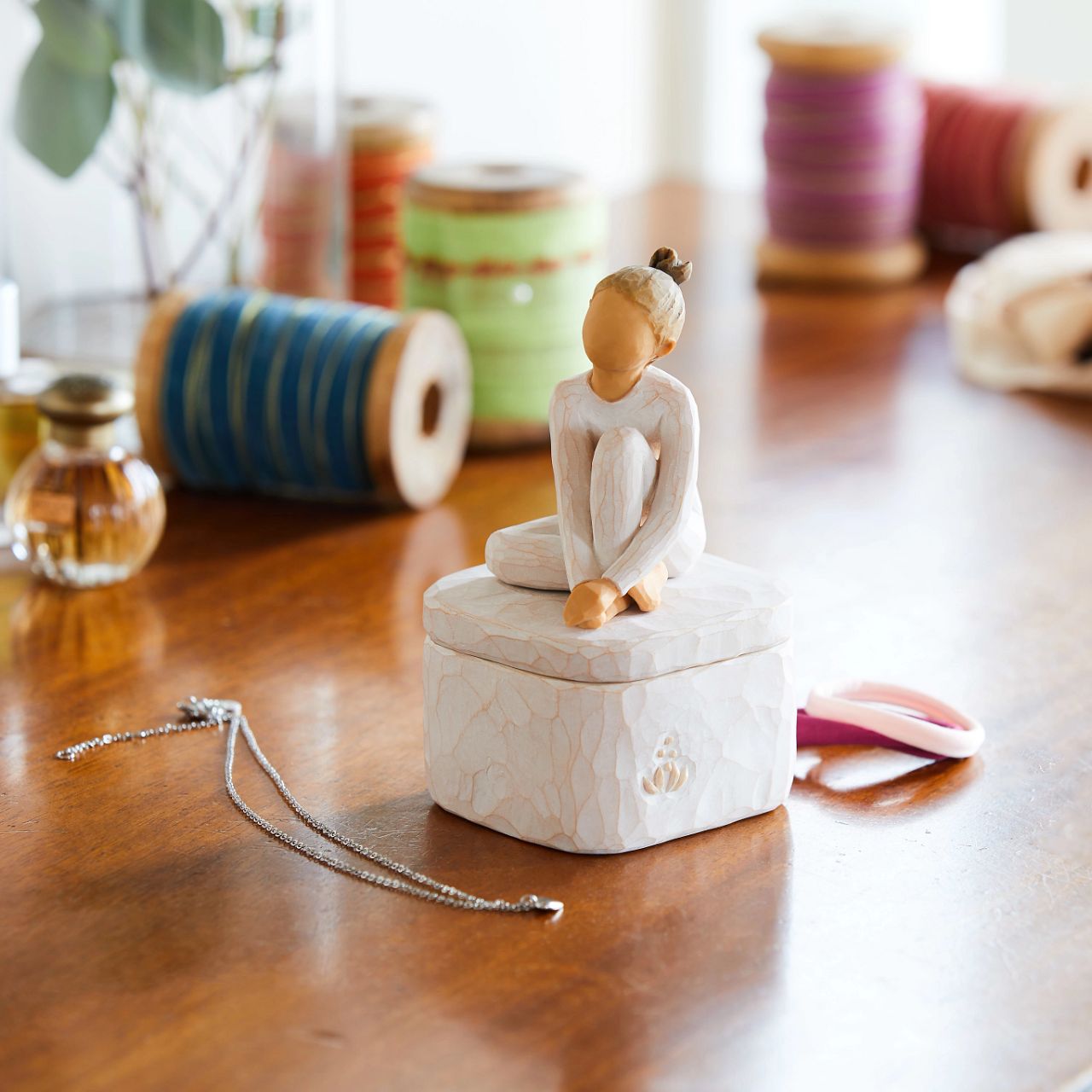 The Dancer Keepsake Box by Willow Tree  A gift for dancers, young and old, or those who enjoy the art and creative expression of dance. Keepsake Boxes are small, sweet places to keep treasures, hair ties, jewellery. Hand-painted bas-relief lid is not attached. Inside, bottom of the box reveals the sentiment, "Creative expression comes from within"