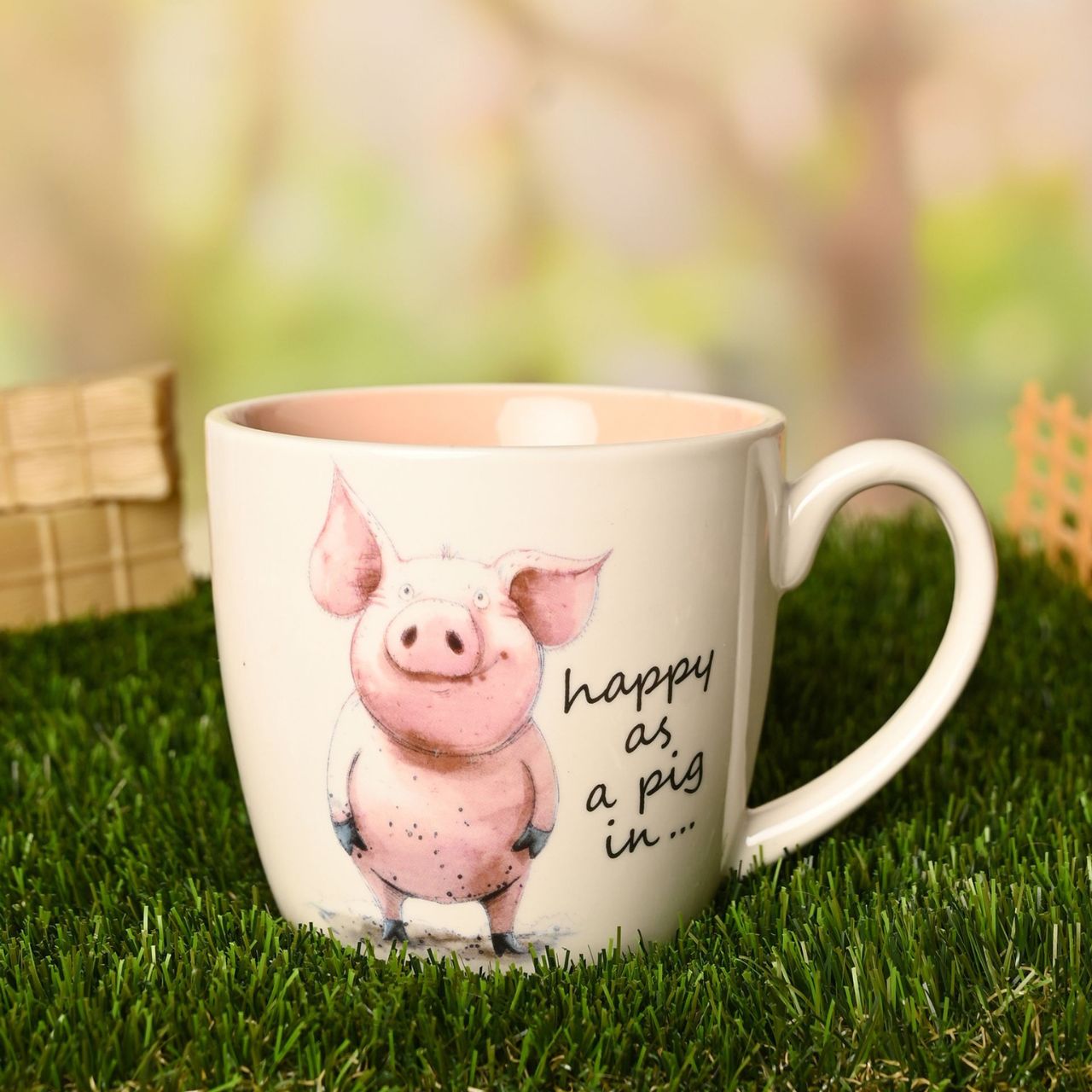 The Funny Farm Mug - "Happy as a Pig in..." brings farmyard charm and cheeky humour to the morning cuppa, featuring an irresistibly cheerful pig character that captures the spirit of countryside contentment.