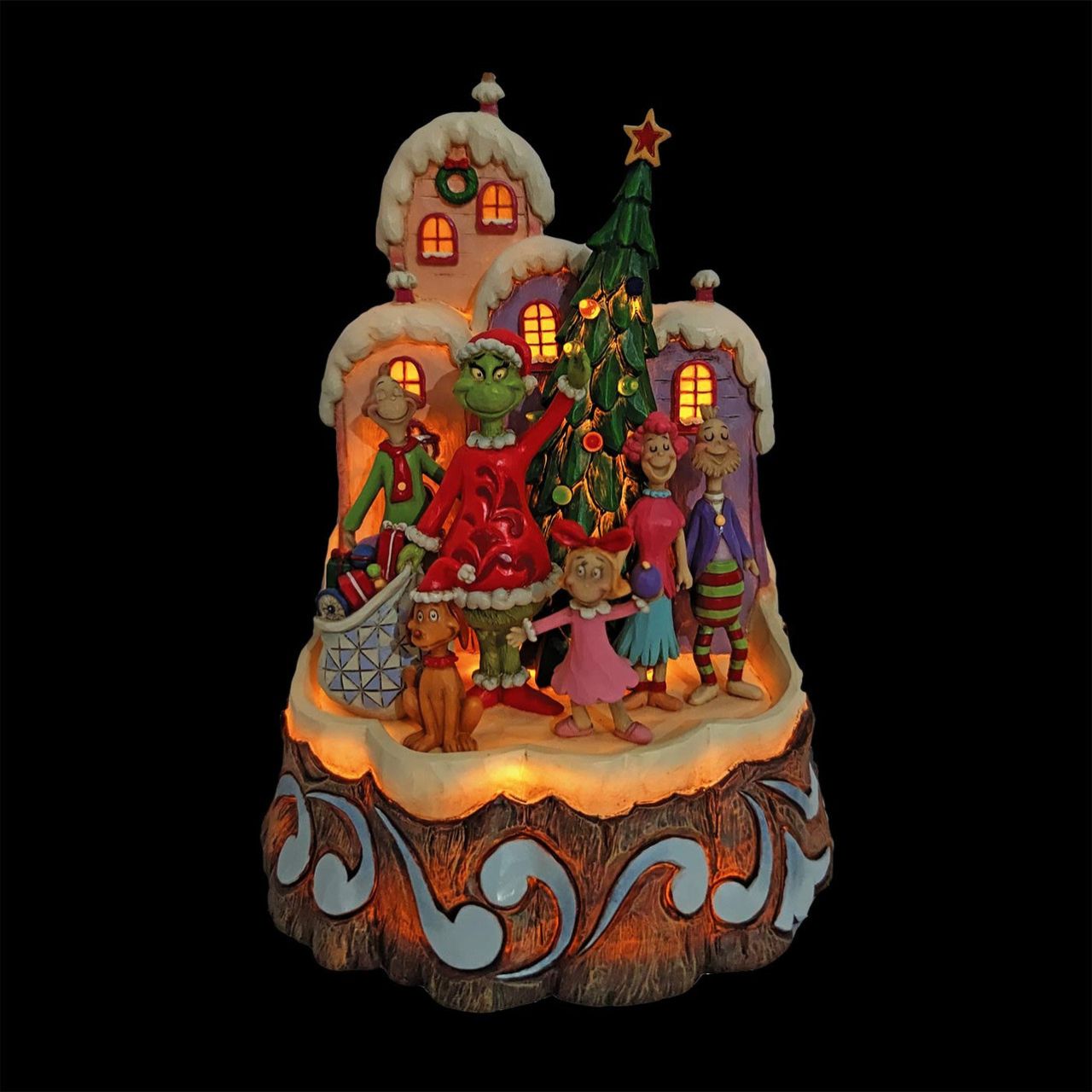 With an honest smile, the Grinch, by Jim Shore, has realized the true meaning of Christmas and for once, feels love in his heart. Together with Max and the residents of Whoville, Grinch waves solemnly with Cindy Lou Who in the decorated town. Lights Up Requires 3 AAA Batteries (not included) Beautifully hand-painted and crafted.