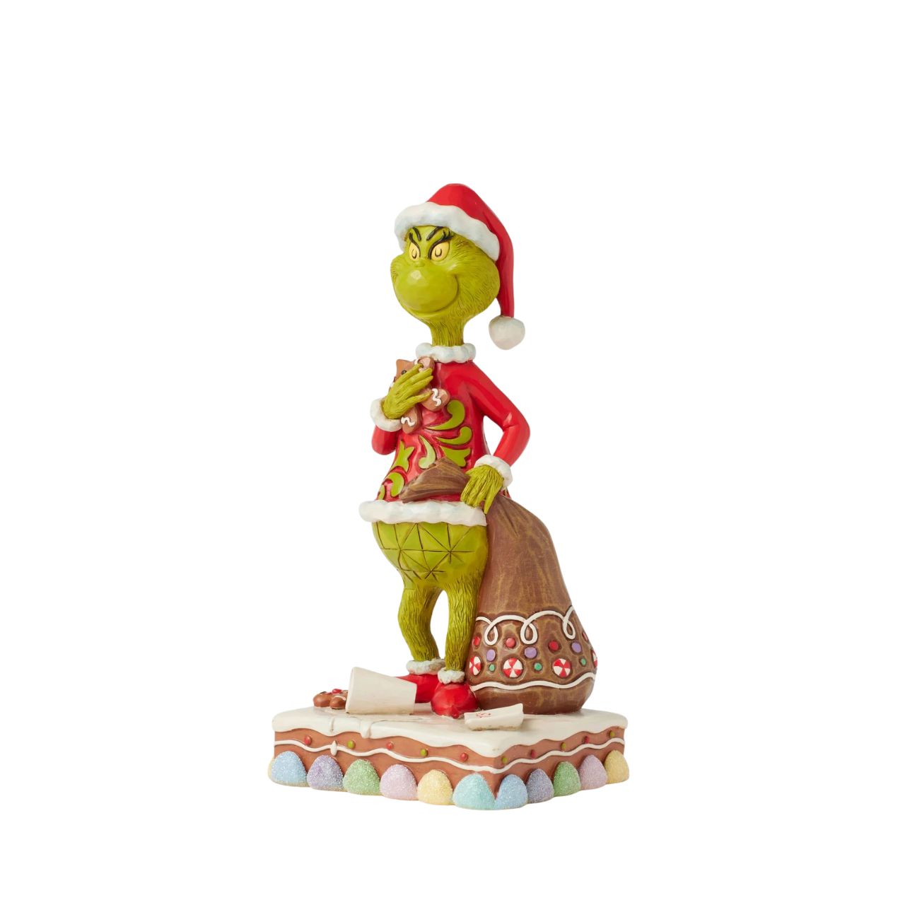Dressed as Santa with a sack to steal presents, The Grinch gleefully munches on cookies and spills Santa's milk. Adorned with Jim Shore's signature rosemaling and intricate details, this piece brings The Grinch's playfully sinister spirit to life.