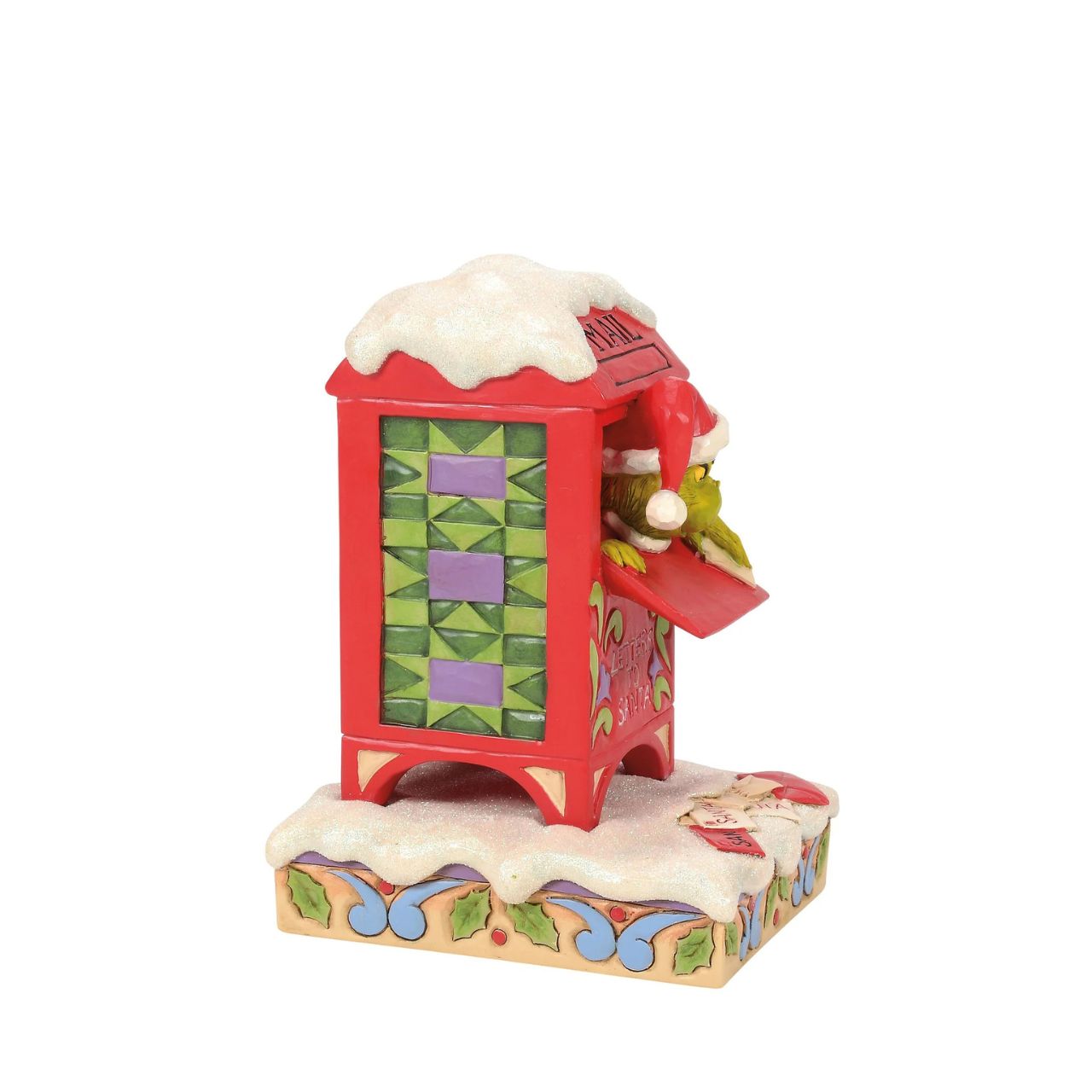 In a comical scene of holiday mischief, The Grinch hides inside a red mailbox, tearing up letters to Santa. Decorated with Jim Shore's signature rosemaling and patchwork, this piece captures The Grinch's sneaky spirit with a festive twist.