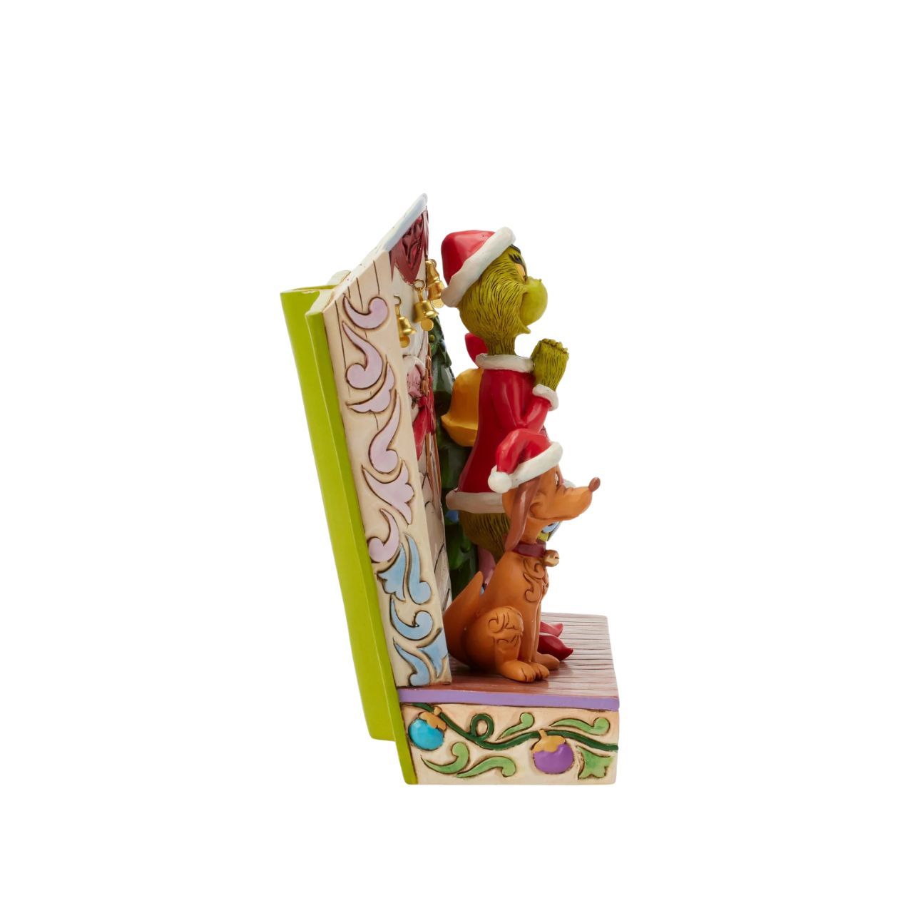 Framed within the classic Dr. Seuss book, this Jim Shore piece captures The Grinch's heartwarming transformation with Cindy Lou and Max by his side. Dressed as Santa, he smiles with rosemaling, patchwork patterns, and real jingle bell details.