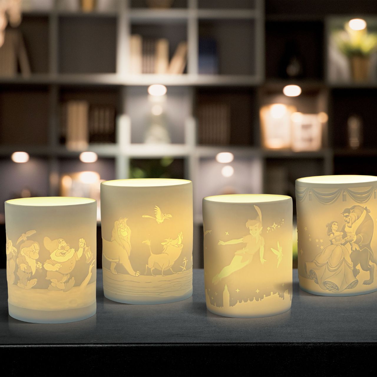 Disney Moonlight Philosophy The Lion King Tea Light Holder  Simba, Timon, Pumba and Zazu will seem as if they are growing up right before your eyes when you light the LED candle, and as they flicker across your room. The Lion King characters are etched into the thin translucent porcelain which radiates a warm night light.