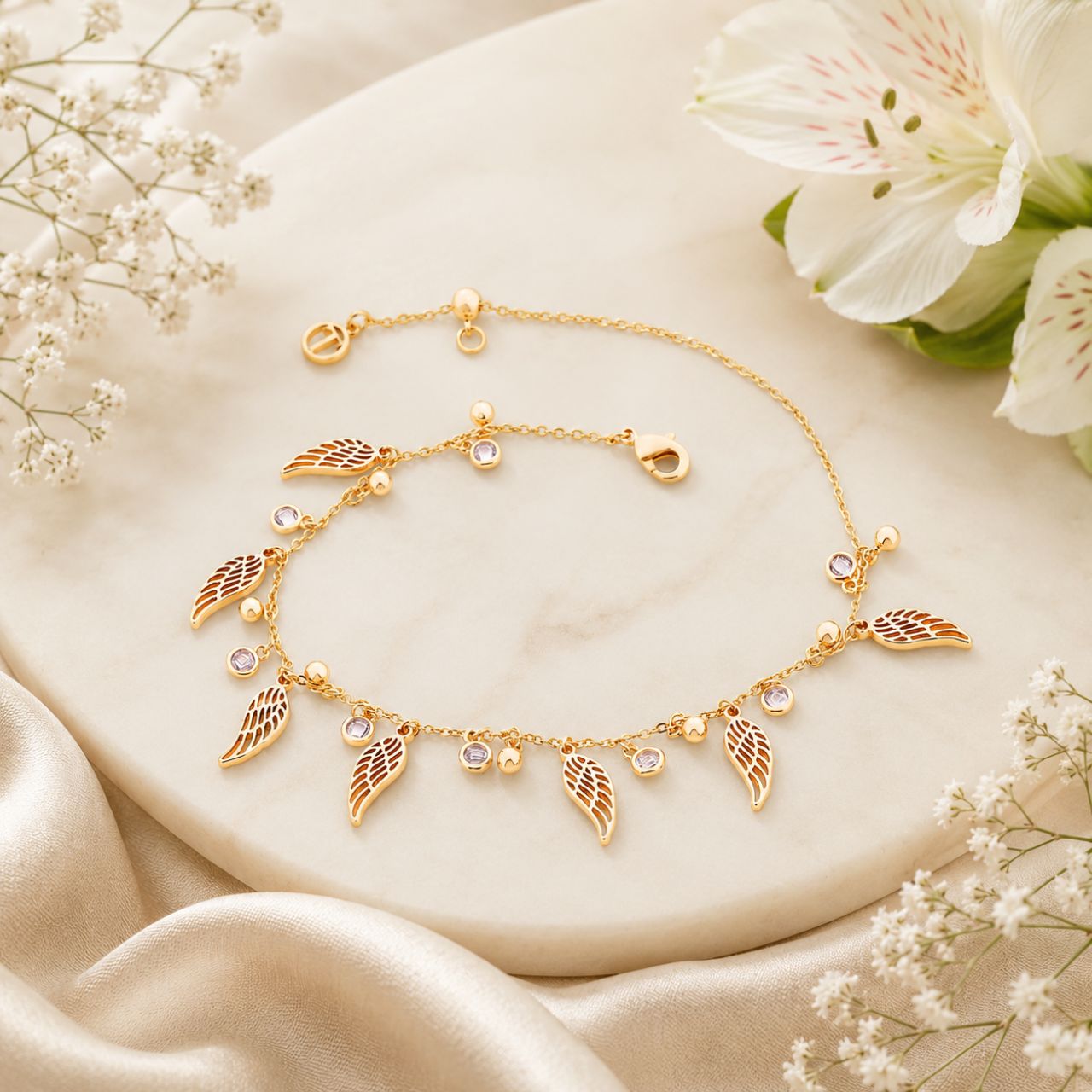 Expertly crafted, this Tipperary Angel Wings Bracelet Ball & Crystal Chain Gold is a stunning piece. With its intricate angel wings, crystal detailing, and delicate gold chain, this bracelet is sure to elevate any outfit. A timeless addition to any jewellery collection.