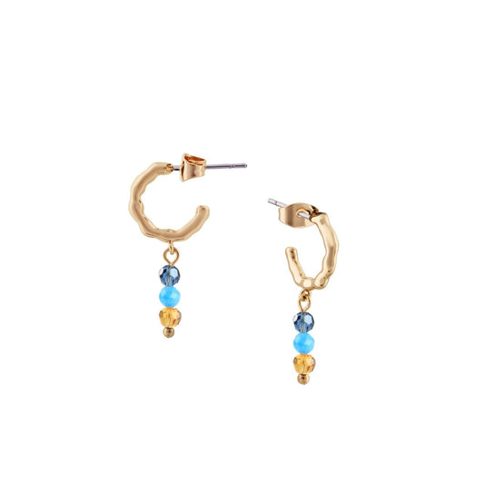 Elevate your elegance with the Tipperary Beads Turquoise Mini Hoop Earrings. These delicately crafted hoops feature vibrant turquoise beads that add a refined splash of colour to any ensemble.