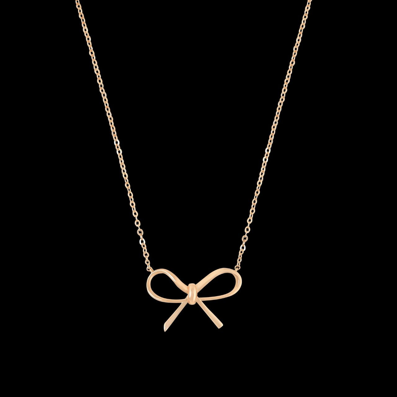 Crafted in radiant gold, the pendant’s sleek bow silhouette reflects the collection’s signature harmony of delicate design and meaningful expression. Its warm metallic finish adds a touch of refined polish, making it a versatile accessory for both everyday wear and special occasions.