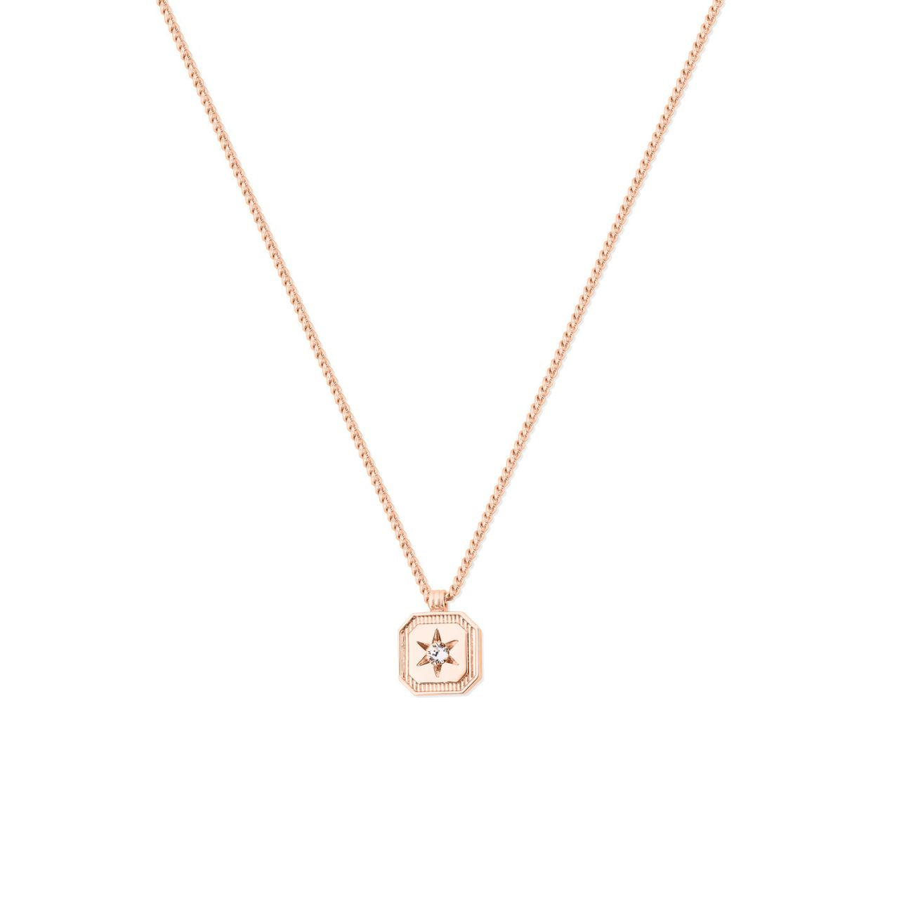Elevate your style with the Tipperary Compass Star Pendant in Rose Gold. This intricately crafted piece blends timeless elegance with a modern edge, featuring a delicate compass star design that symbolizes direction and guidance.