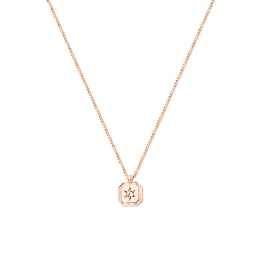 Elevate your style with the Tipperary Compass Star Pendant in Rose Gold. This intricately crafted piece blends timeless elegance with a modern edge, featuring a delicate compass star design that symbolizes direction and guidance.