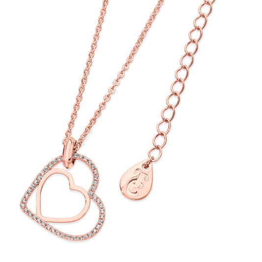 Floating Heart Pendant Rose Gold by Tipperary Crystal  Especially for the one you love this meaningful design is styled in warm rose gold. It features two open hearts - one smaller polished rose gold heart set inside the larger outline heart with a glittering border of clear crystal accents. This captivating pendant is finished with a brightly polished bale and suspends freely at a tilt along a cable chain which secures with a lobster claw clasp with 2” extension and a TC branded fob.