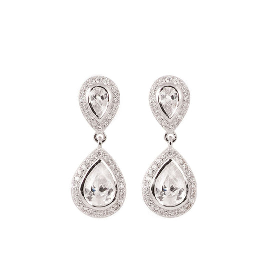 Tipperary Pear Shaped CZ Drop Earrings Silver  These elegant double tear-drop earrings are a captivating look. Fashioned in silver, each earring features a pear-shaped center stone bordered with a halo of shimmering clear crystal accents. A duplicate of these pear-shaped drops suspends from the ﬁrst creating a sparkling mirror image. Polished to a brilliant lustre, these versatile post earrings secure comfortably with push backs.