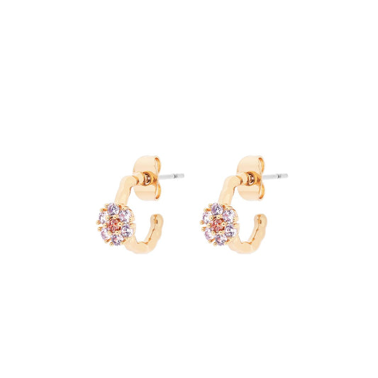 Daisy Hoop Earrings Gold by Tipperary  These chic hoop earrings feature daisy designs for a classic, timeless look. With their understated elegance, these earrings are perfect for day-to-night wear.