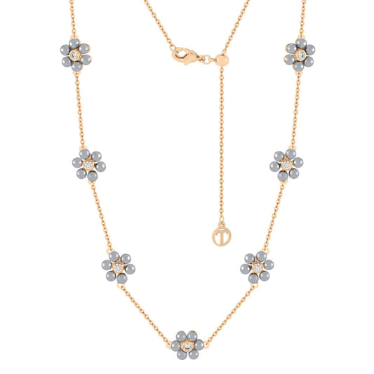Elegant and versatile, the Daisy Grey Pearl Necklace embodies the timeless beauty of the daisy flower. Each bloom is crafted with lustrous grey pearl petals surrounding a sparkling CZ centre, set along a polished gold adjustable chain.