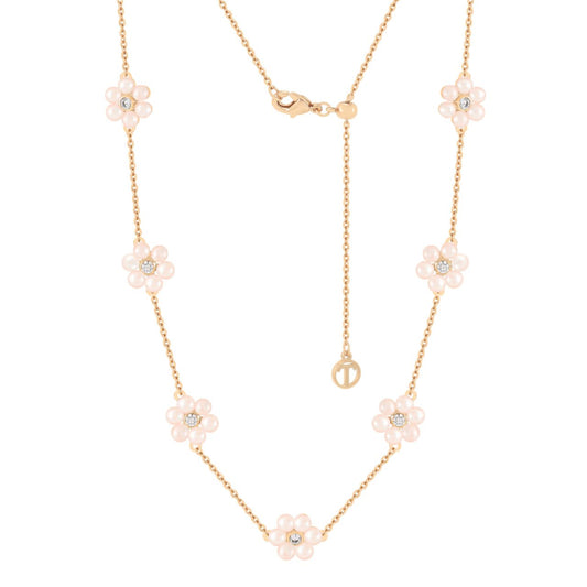 Elevate your elegance with the Tipperary Daisy Pink Pearl Necklace in Gold. This refined piece features delicate pink pearls gracefully strung to complement its warm gold setting, creating a subtle yet striking accessory.