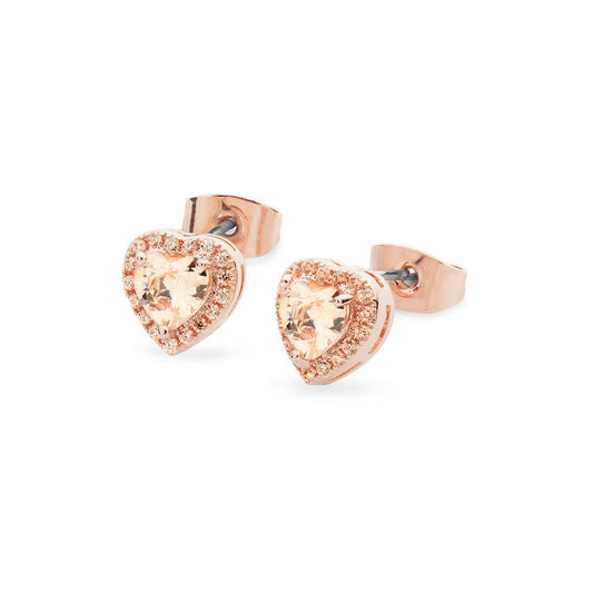 Crafted in rose gold, each eye-catching stud earring features an enchanting heart-shaped champagne crystal center stone framed with a border of shimmering crystal accents. Buffed to a bright lustre, these earrings secure comfortably with push backs.