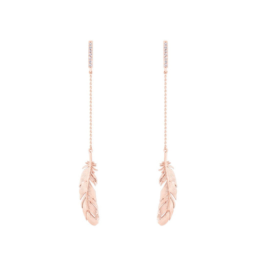 Rose Gold Feather & Chain Long Earrings by Tipperary  These Rose Gold Feather & Chain Long Earrings by Tipperary will instantly upgrade your look. Crafted with rose gold plated brass, this timeless jewellery piece is lightweight and durable. Enjoy the beauty of a classic design that will last for many years to come.