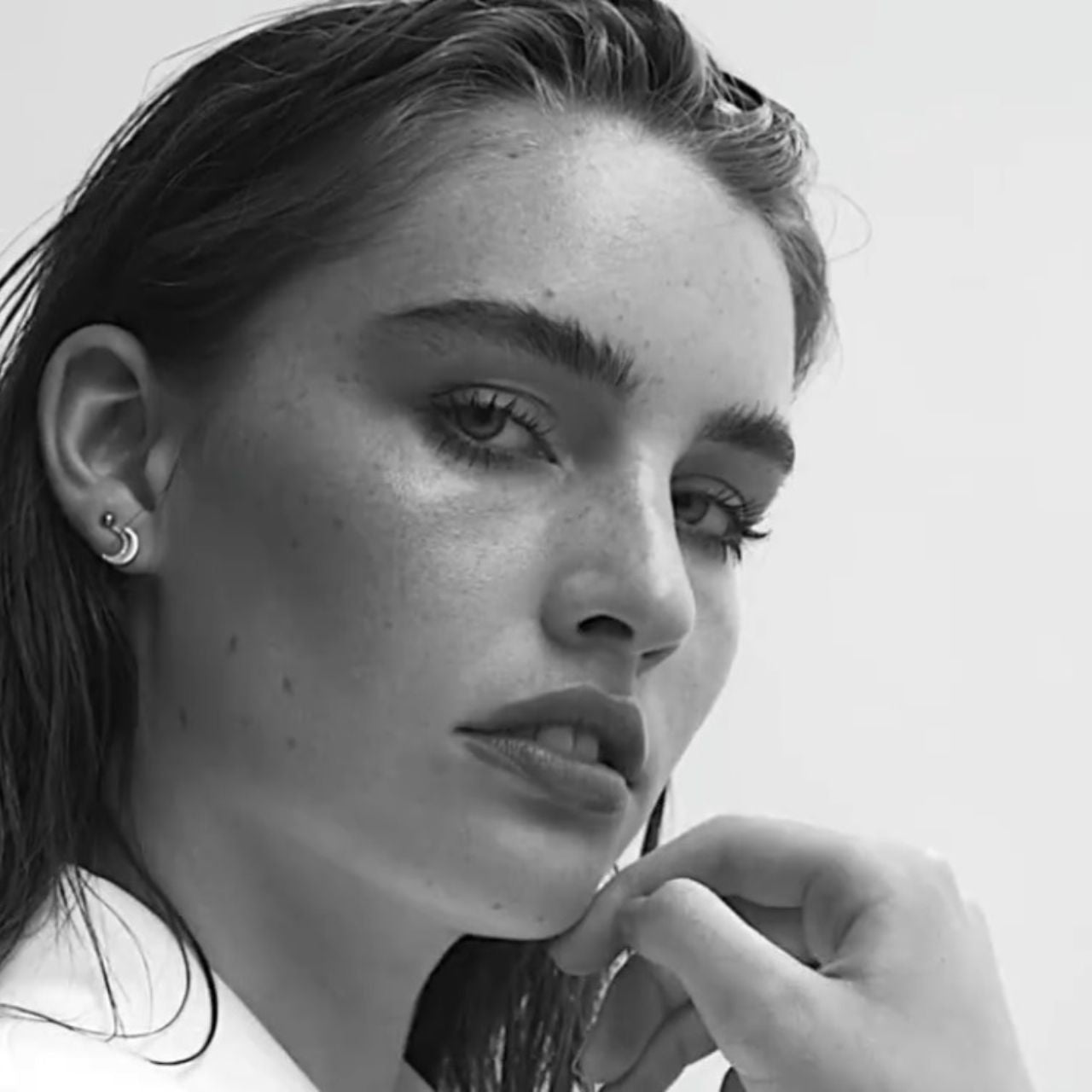 Half Moon Stud Rose Gold Earrings by Tipperary  Inspired by the hypnotic energy of the glowing moon, this collection is contemporary and minimalist yet luxuriously adorned with the clearest sparkling stones.