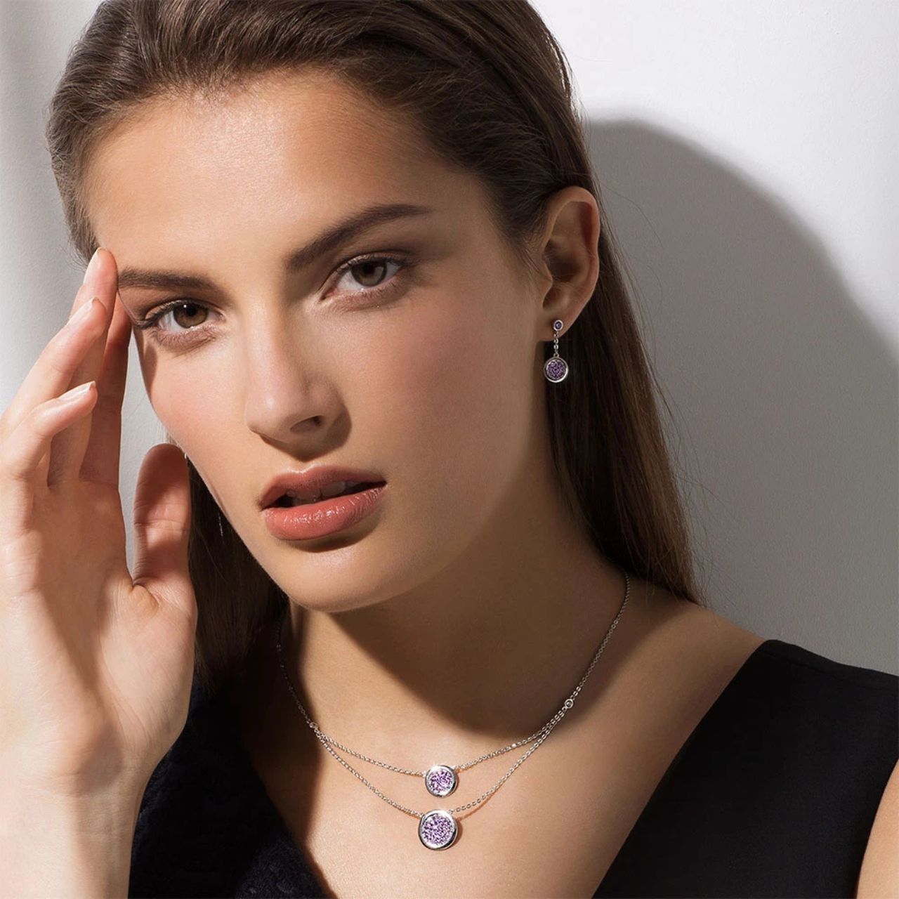 A sparklingly chic design, this crystal double strand necklace takes any look to a new level. Crafted in silver it features two full circles of rich lavender crystals with a highly polished border.