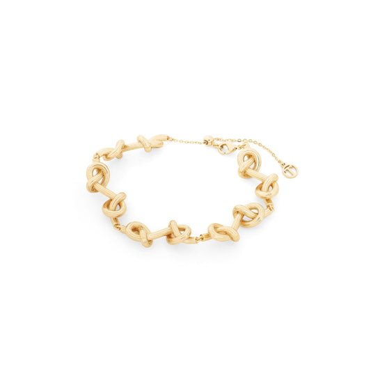 Celebrate the bonds that matter most with this stunning Tipperary Love Knot bracelet. Each of the ten intricately crafted knots represents a cherished connection—whether to loved ones, meaningful moments, or personal milestones.